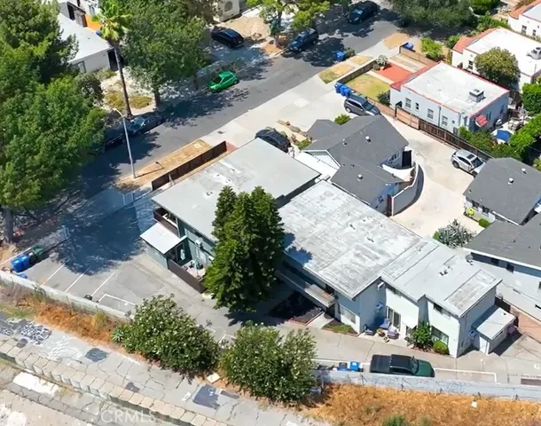 an aerial view of a house with outdoor space