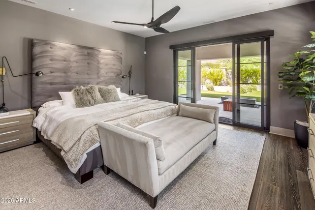 a spacious bedroom with a bed and a couch