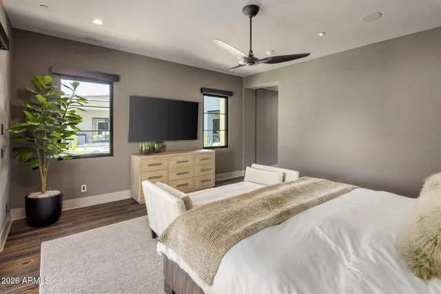 a view of a living room with furniture and wooden floor