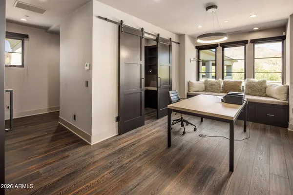 a bed sitting in a room next to a window