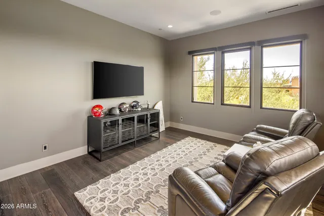 a view of a house with pool porch and sitting area