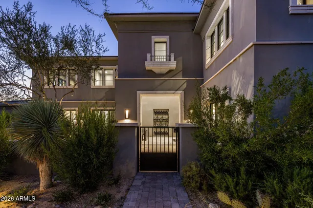 a view of a bathtub and fire pit in front of house