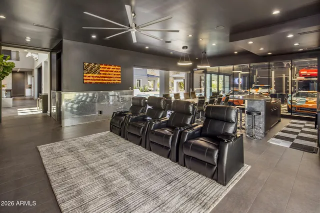 a view of house with swimming pool and outdoor seating