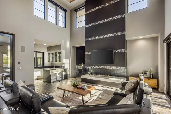 a living room with furniture and a large window