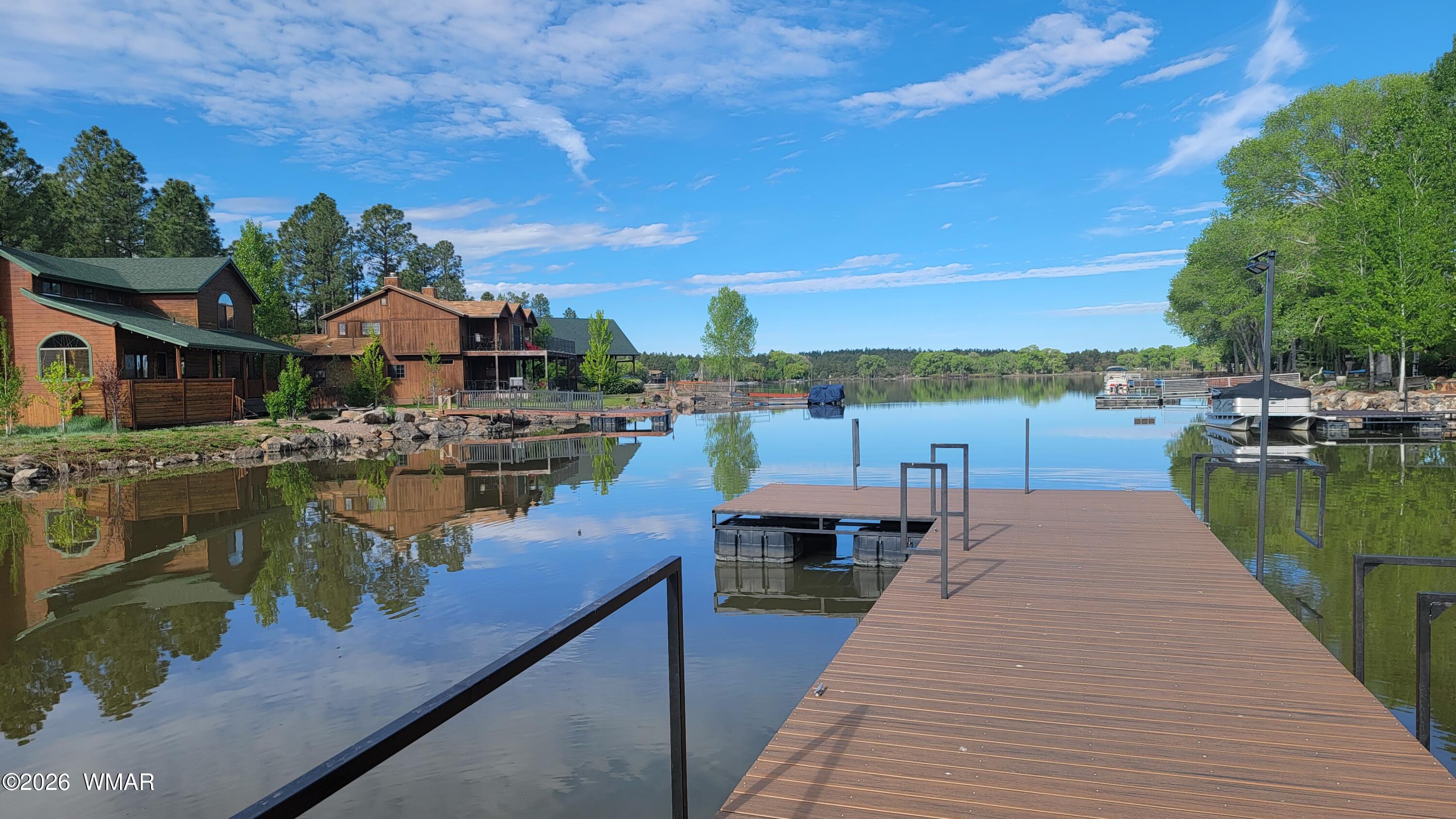 826 Pine Creek Circle Lakeside, AZ 85929 - Photo 54 of 65 a view of a lake with a table and chairs
