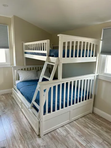 a view of wooden floor and windows