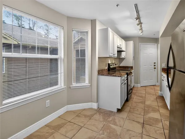 a view of a bathroom with wooden floor