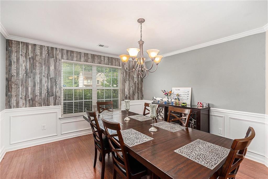 Undisclosed Address Hampton, GA 30228 - Photo 15 of 45 a view of a dining room with furniture window and wooden floor