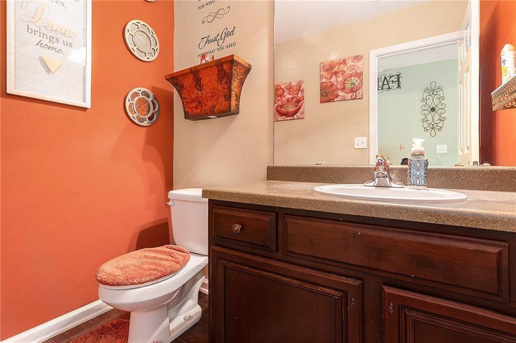 Undisclosed Address Hampton, GA 30228 - Photo 20 of 45 a bathroom with a toilet a sink and a mirror