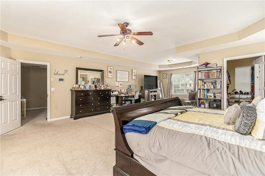 Undisclosed Address Hampton, GA 30228 - Photo 22 of 45 a bed room with a bed and ceiling fan