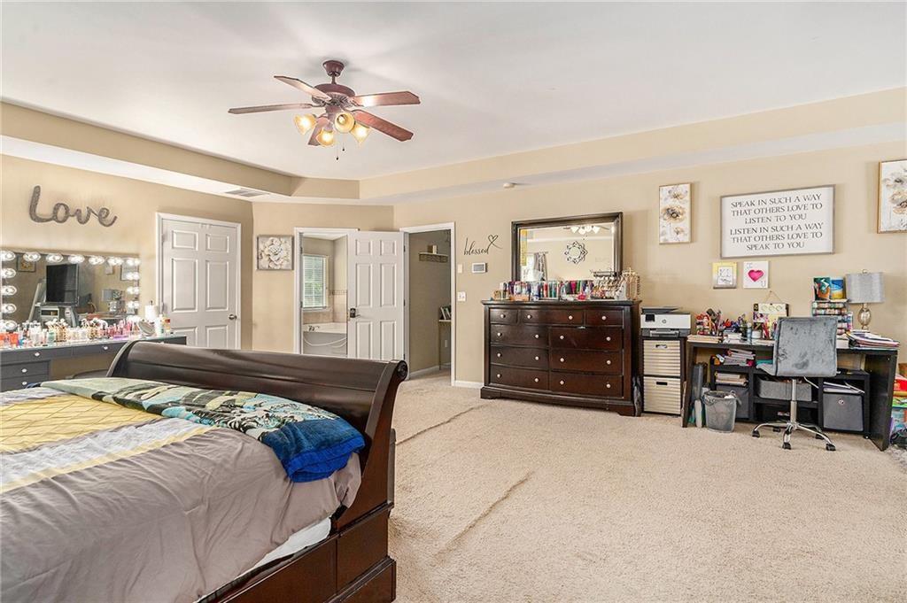 Undisclosed Address Hampton, GA 30228 - Photo 24 of 45 a bed room with a bed and furniture