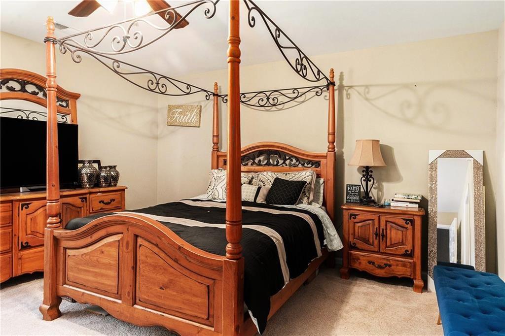 Undisclosed Address Hampton, GA 30228 - Photo 28 of 45 a bedroom with two beds and a flat screen tv