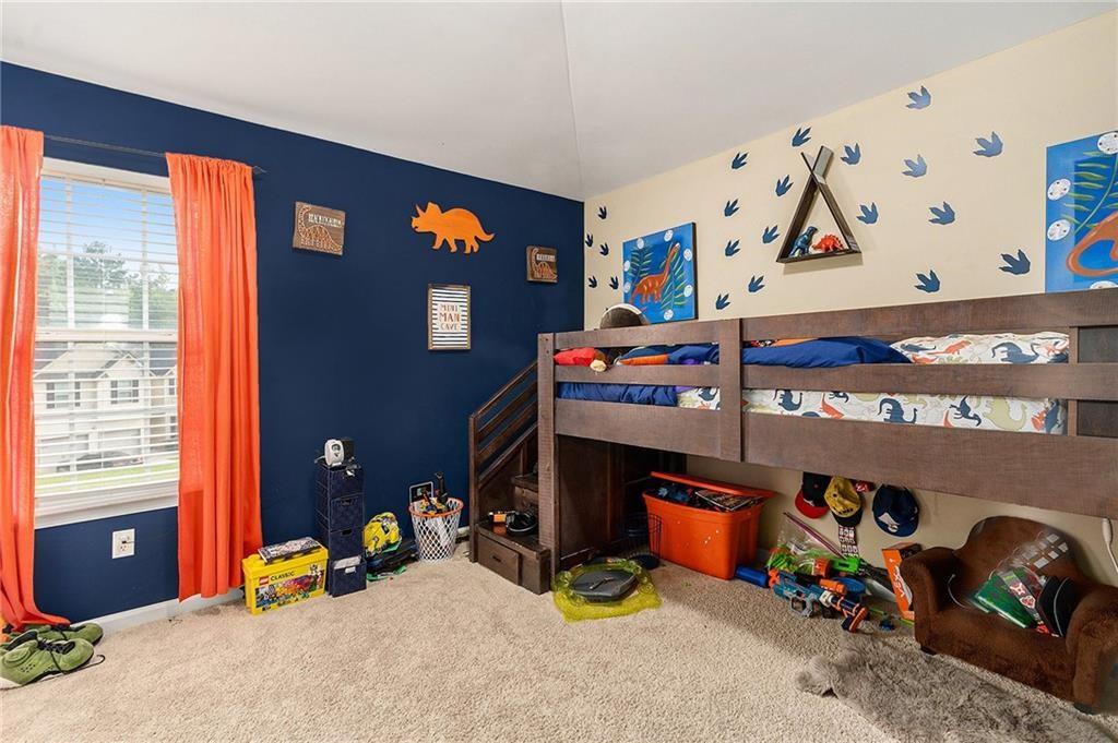 Undisclosed Address Hampton, GA 30228 - Photo 31 of 45 a bed room with a bed and a window