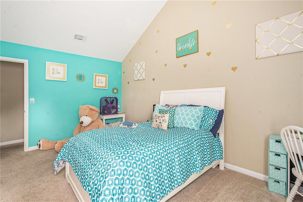 Undisclosed Address Hampton, GA 30228 - Photo 33 of 45 a bedroom with a bed and furniture