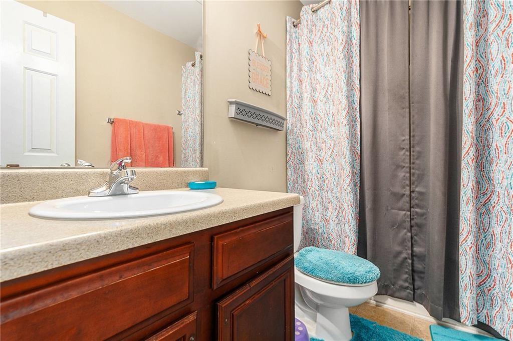 Undisclosed Address Hampton, GA 30228 - Photo 34 of 45 a bathroom with a granite countertop sink toilet and a mirror
