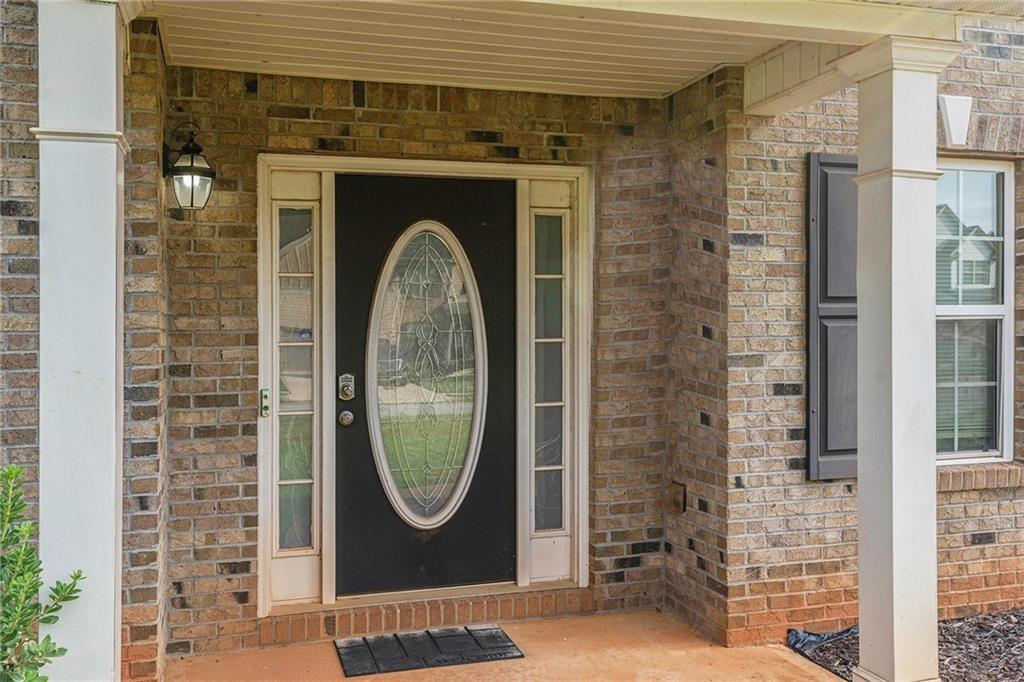 Undisclosed Address Hampton, GA 30228 - Photo 4 of 45 a front view of a house with garden