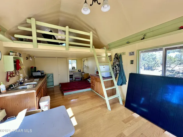 a view of a livingroom with furniture and windows