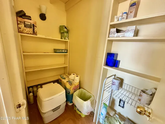 a bathroom with a sink mirror vanity and toilet