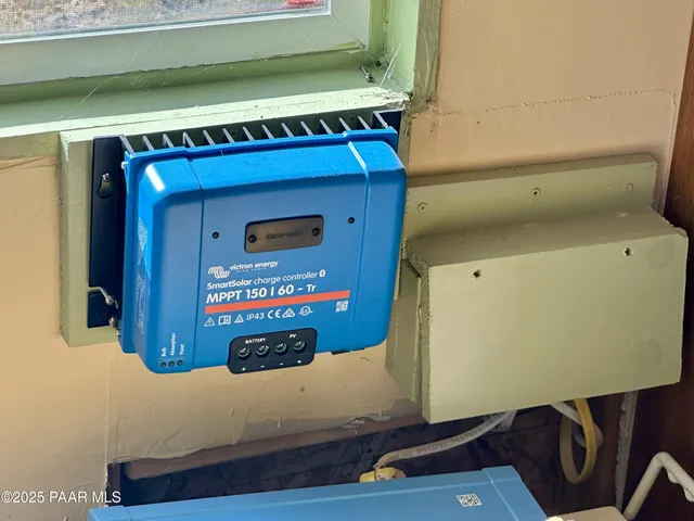 a room with water heater and a cabinet