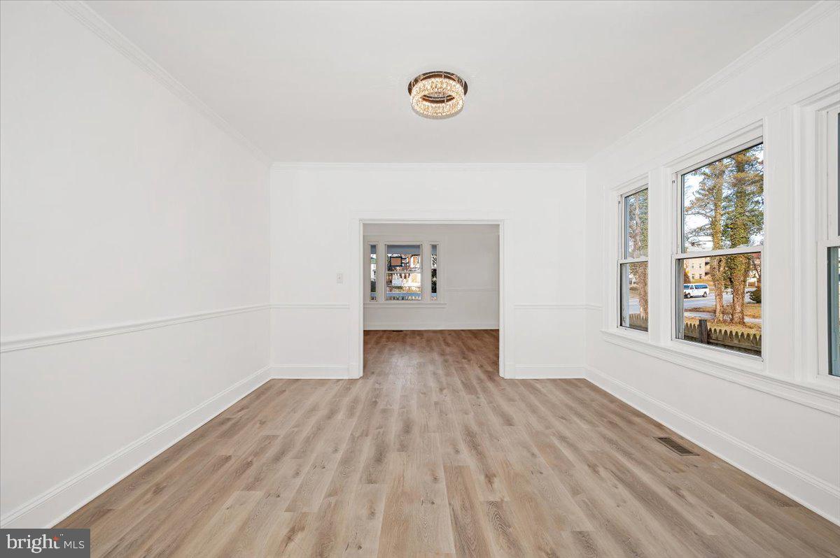 3503 Garrison Boulevard Baltimore, MD 21215 - Photo 13 of 68 a view of livingroom with hardwood floor and window