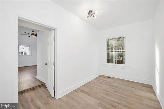 a bathroom with a granite countertop toilet a sink and a bathtub