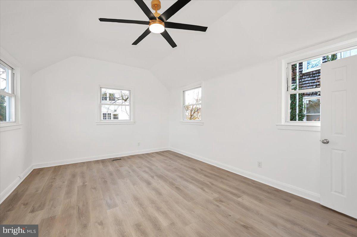 3503 Garrison Boulevard Baltimore, MD 21215 - Photo 23 of 68 a view of a room with wooden floor and windows