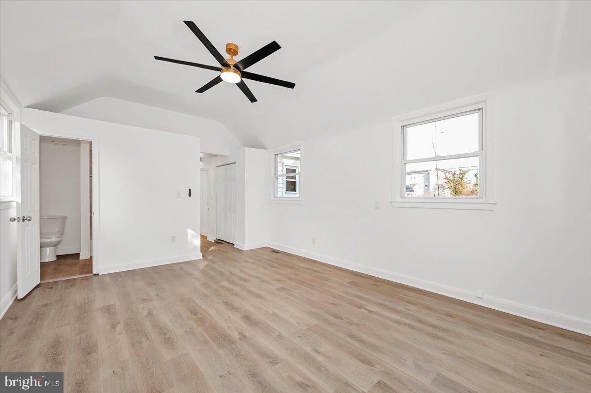 3503 Garrison Boulevard Baltimore, MD 21215 - Photo 24 of 68 a view of empty room with wooden floor and ceiling fan