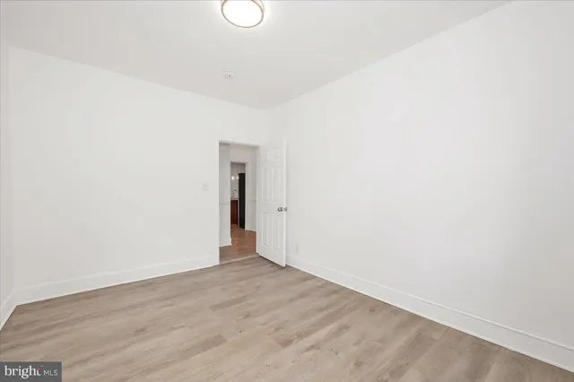 a view of an empty room with stairs