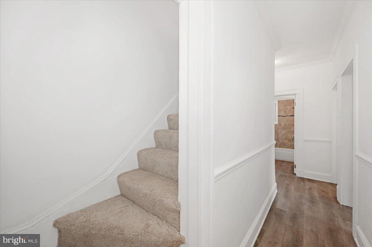 3503 Garrison Boulevard Baltimore, MD 21215 - Photo 31 of 68 a view of hallway with wooden floor