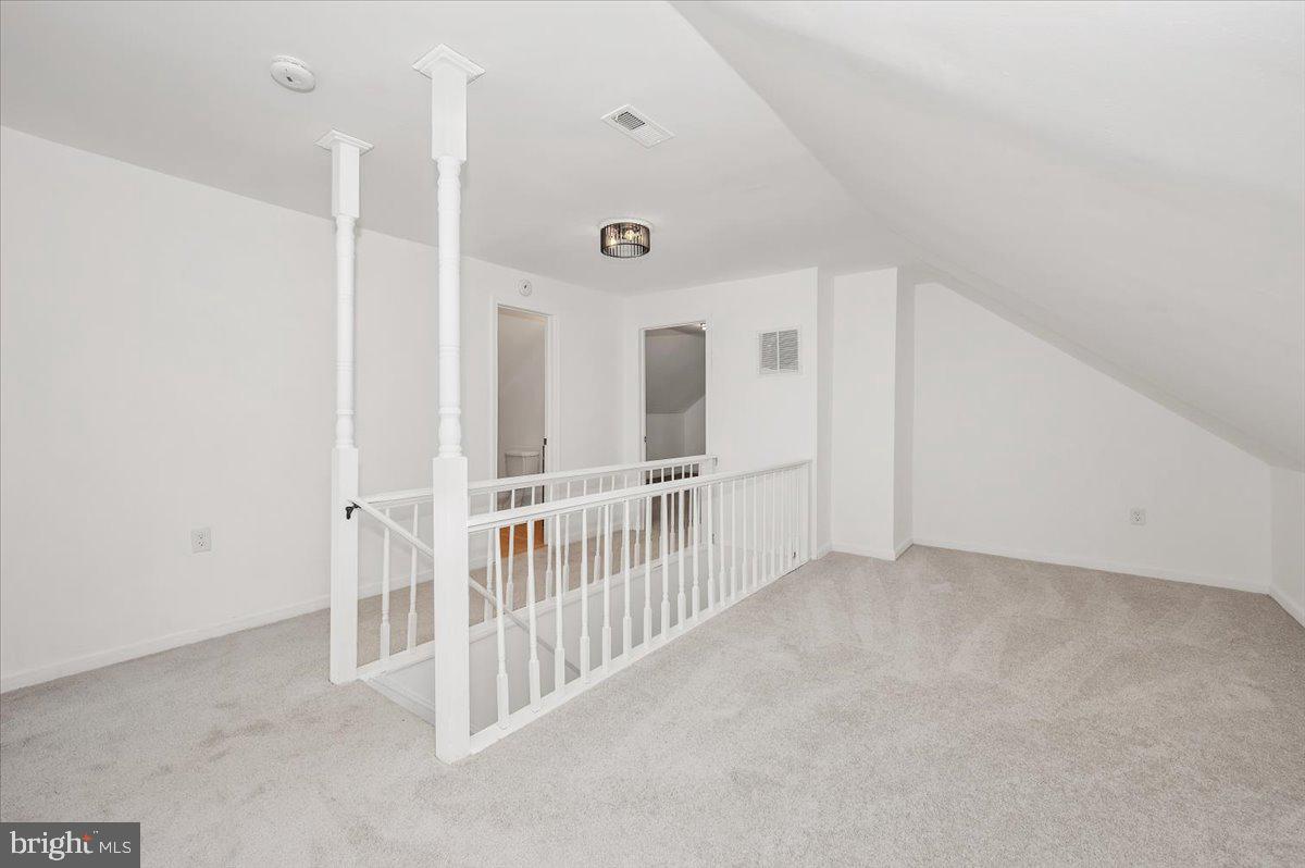 3503 Garrison Boulevard Baltimore, MD 21215 - Photo 33 of 68 a view of an empty room with stairs