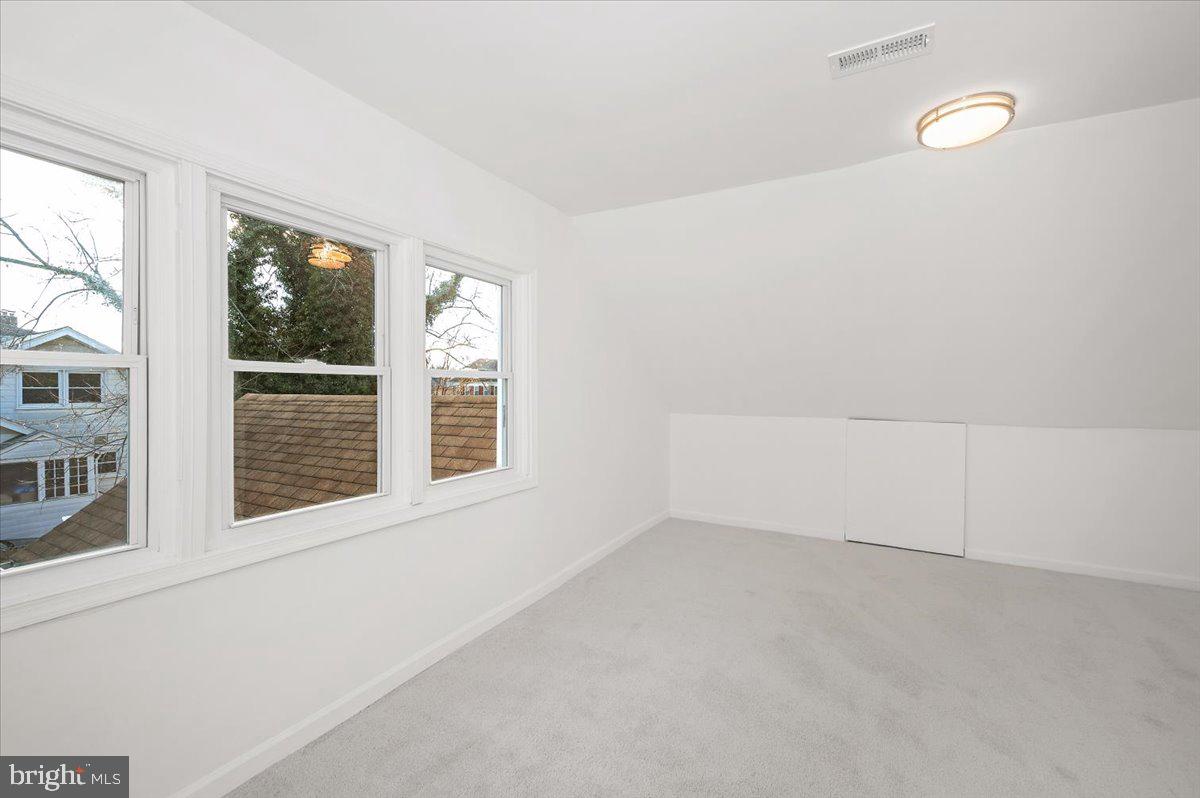3503 Garrison Boulevard Baltimore, MD 21215 - Photo 35 of 68 a view of an empty room with a window