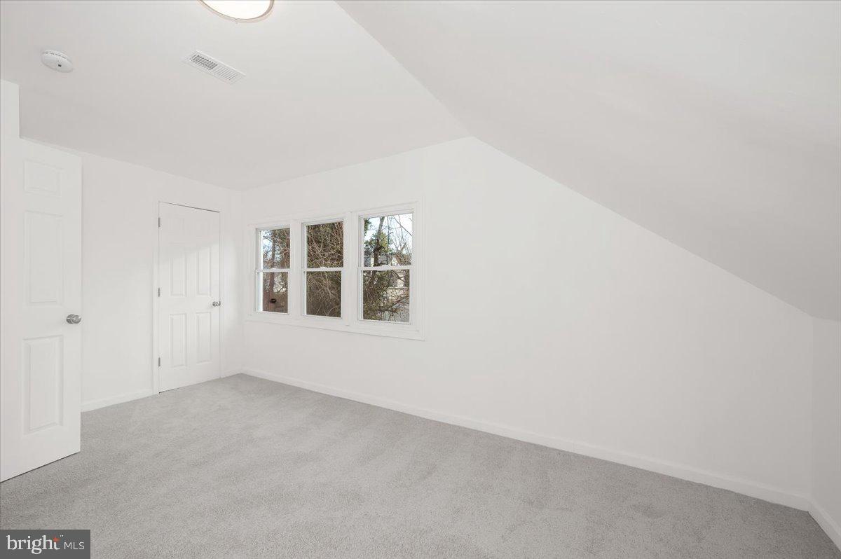 3503 Garrison Boulevard Baltimore, MD 21215 - Photo 36 of 68 a view of an empty room with a window