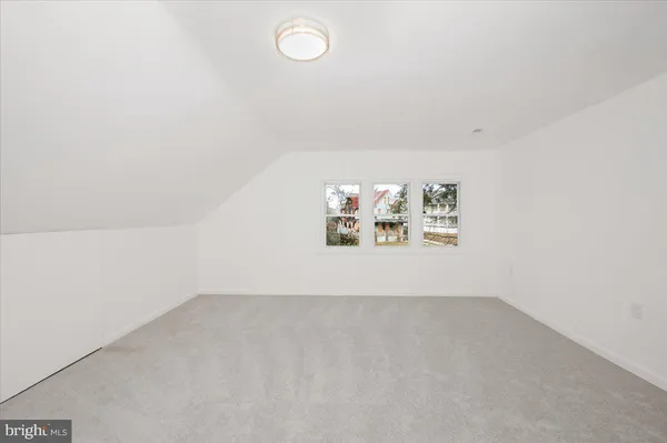 a view of a room with wooden walls