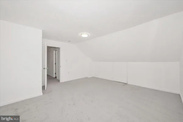a view of an empty room with stairs