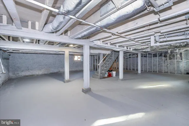 a view of a house with a small yard and wooden fence
