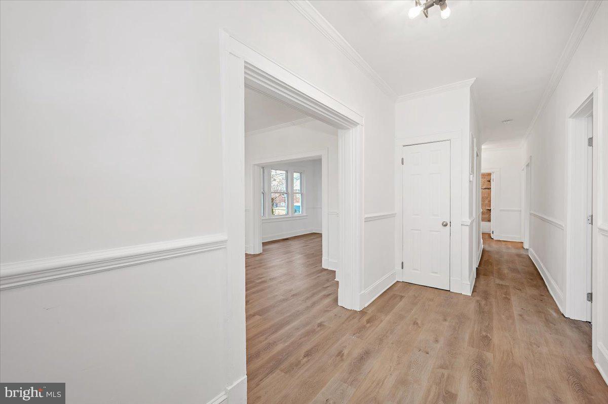 3503 Garrison Boulevard Baltimore, MD 21215 - Photo 5 of 68 a view of wooden floor in an empty room