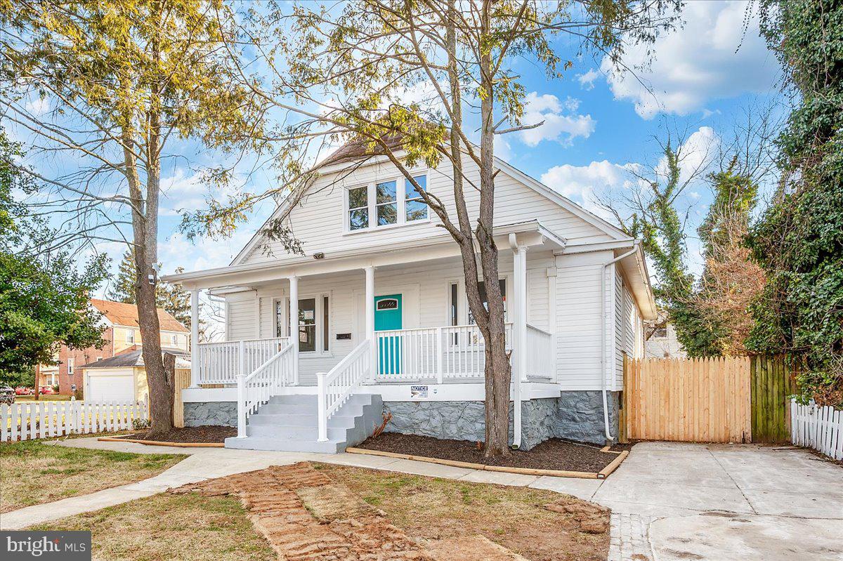 3503 Garrison Boulevard Baltimore, MD 21215 - Photo 68 of 68 a front view of a house with a yard