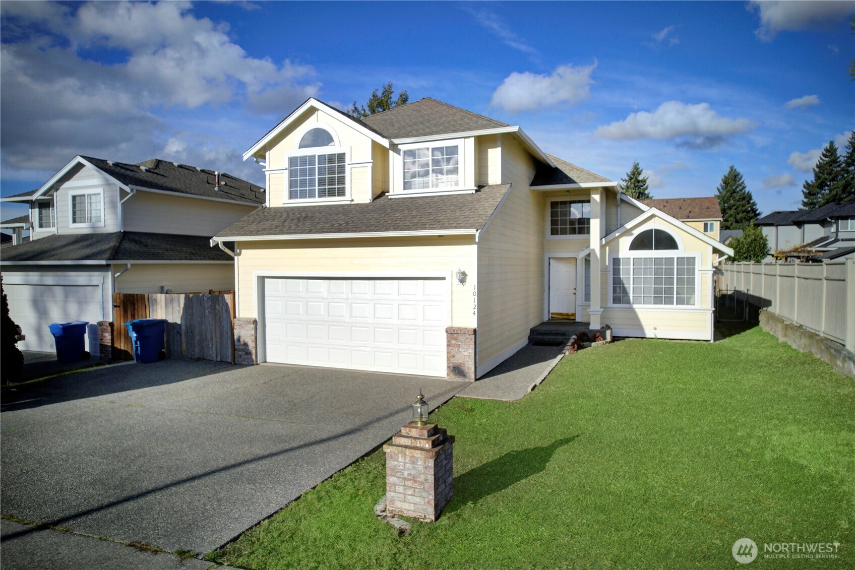 a front view of a house with a yard