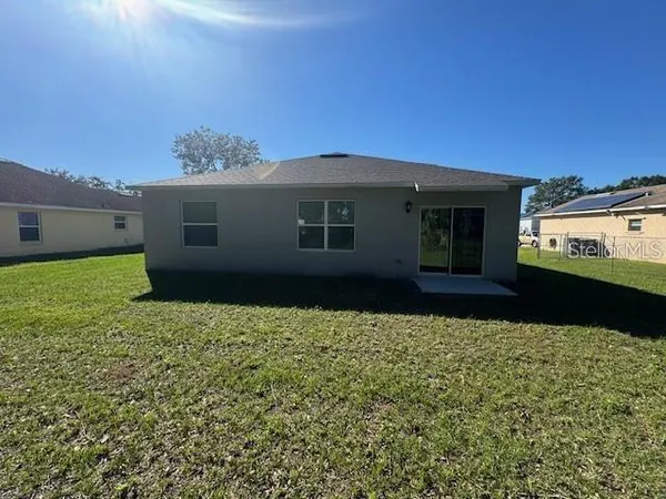 a view of a house with a garden