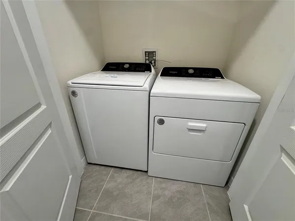 a utility room with dryer and washer
