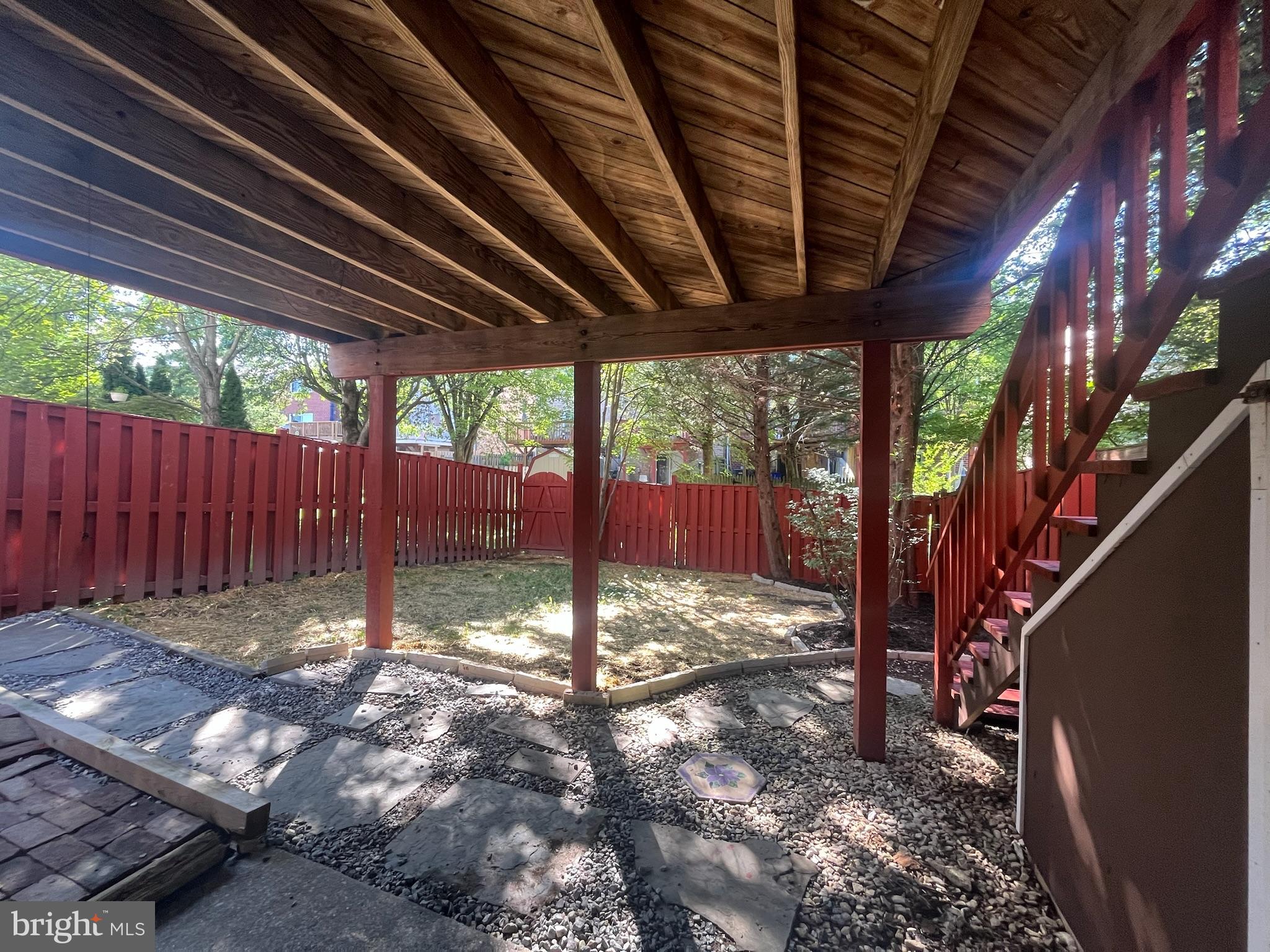8523 Pine Run Court Ellicott City, MD 21043 - Photo 17 of 18 a view of a backyard with wooden fence