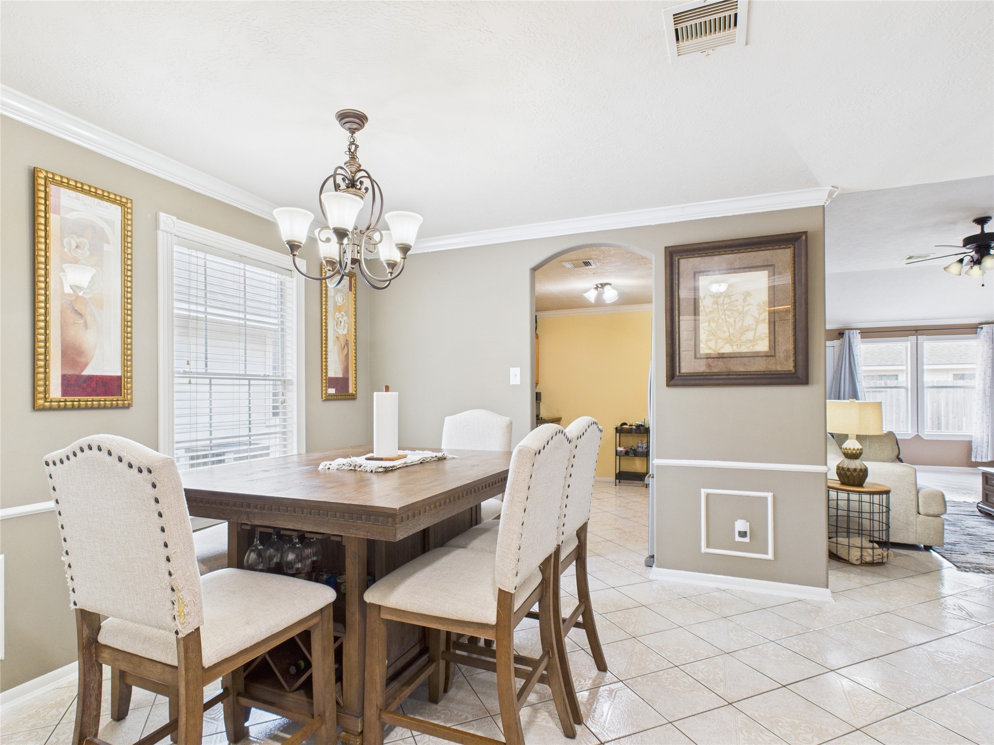 6618 Portlick Drive Katy, TX 77449 - Photo 12 of 40 Bright and inviting formal dining space with tile flooring and crown molding.