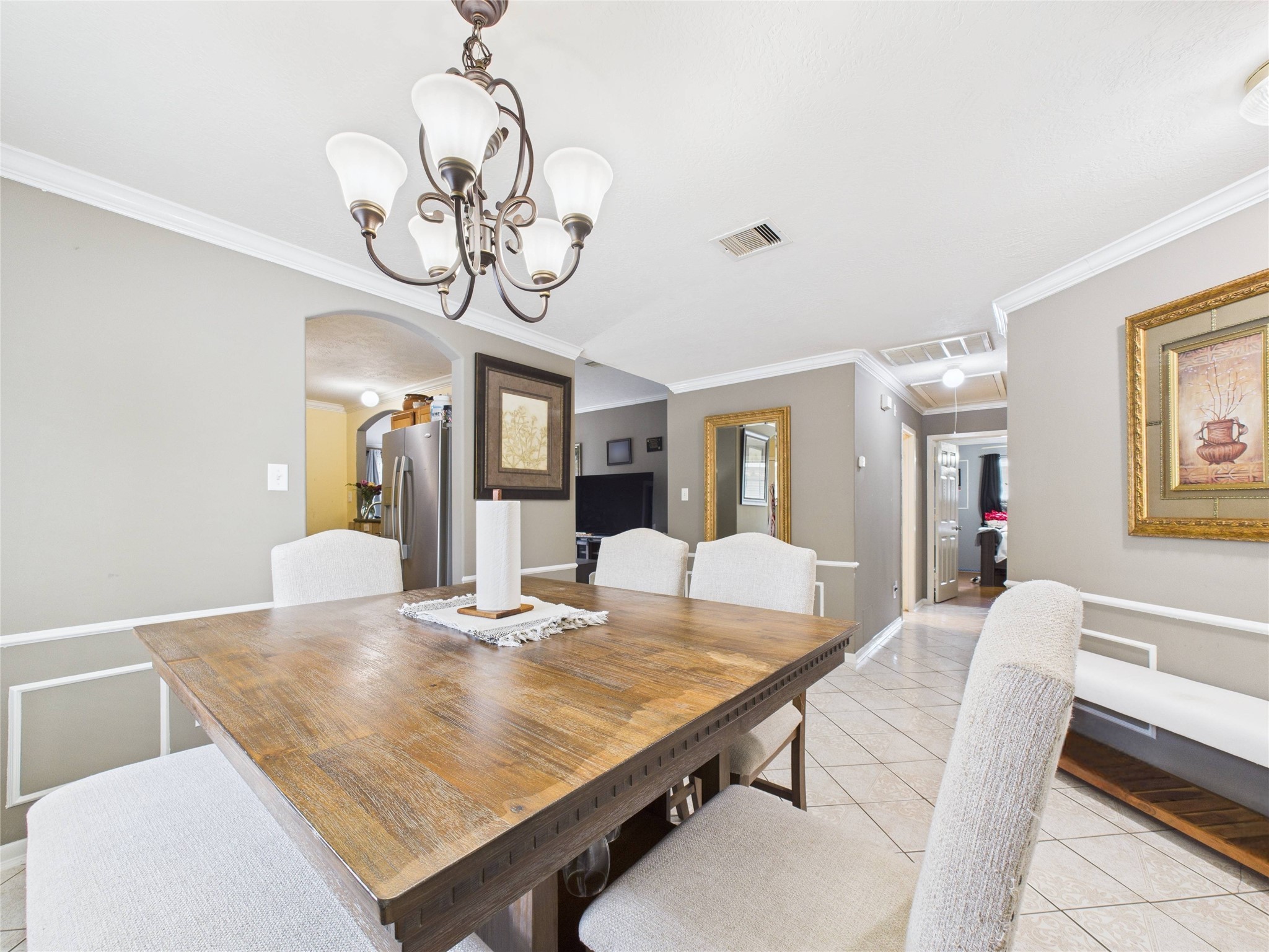 6618 Portlick Drive Katy, TX 77449 - Photo 13 of 40 Open layout connects the dining area to kitchen and hallway.