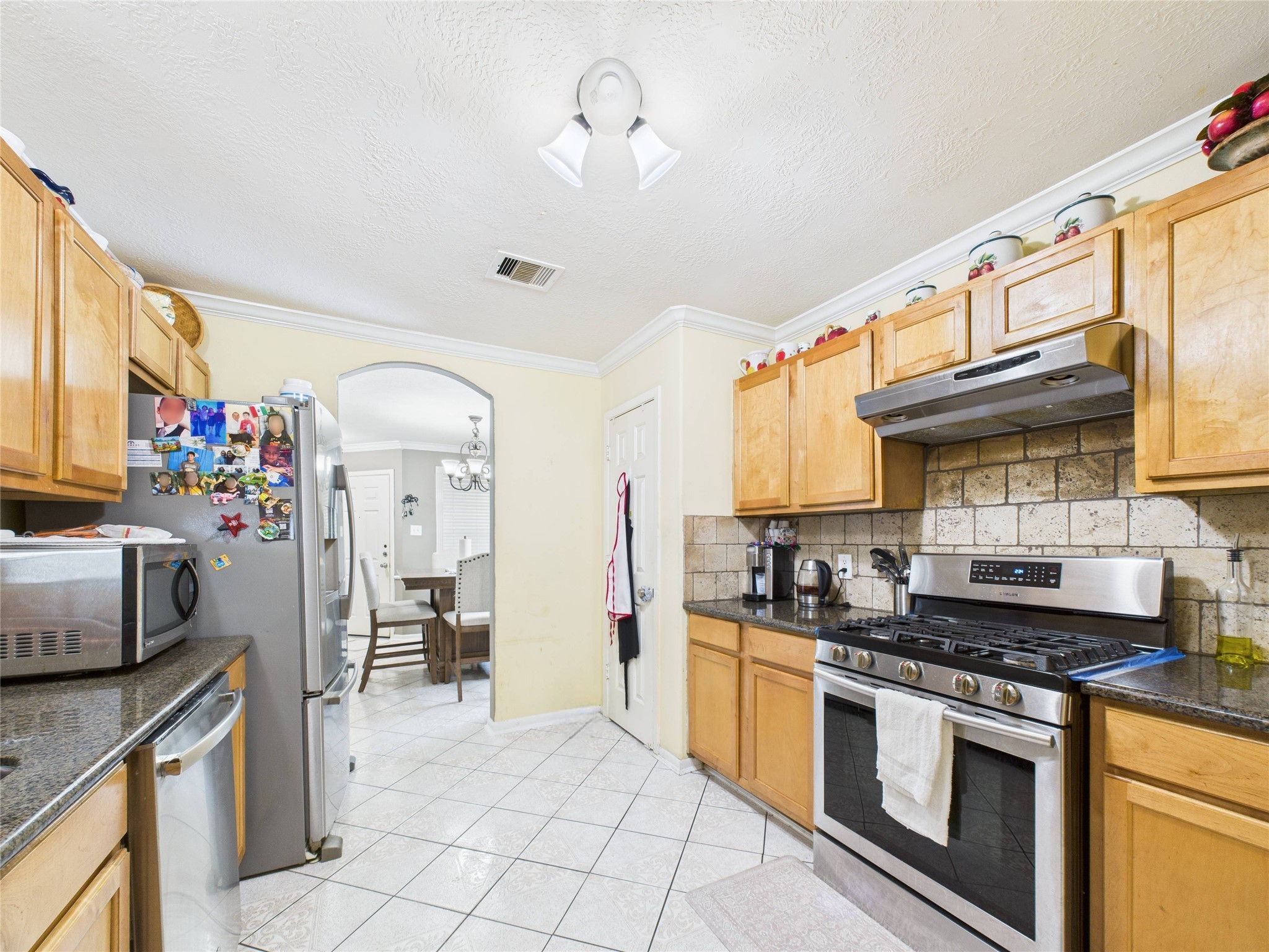 6618 Portlick Drive Katy, TX 77449 - Photo 18 of 40 Convenient pass-through window and stainless steel appliances.