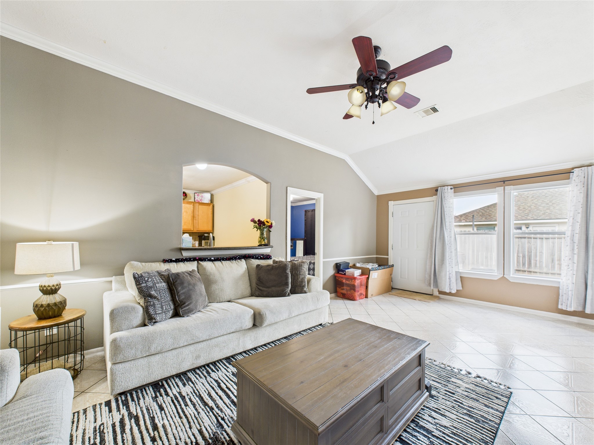 6618 Portlick Drive Katy, TX 77449 - Photo 20 of 40 Spacious living area with vaulted ceiling, neutral tones, and tile flooring.