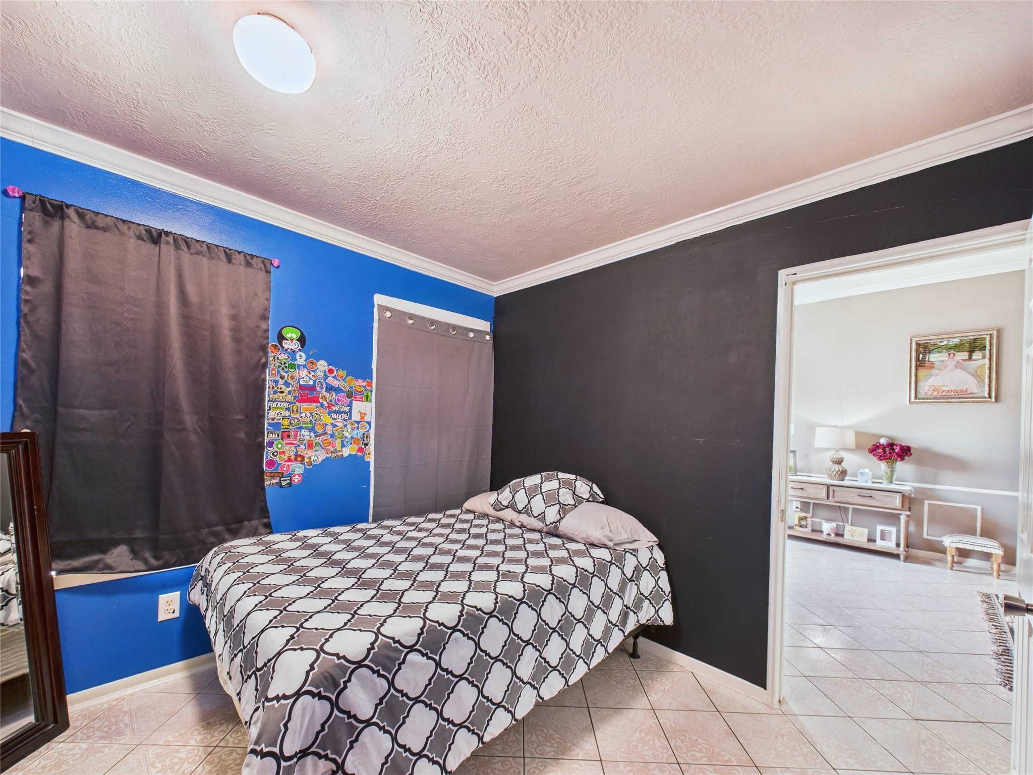 6618 Portlick Drive Katy, TX 77449 - Photo 2 of 40 Cozy secondary bedroom with tile flooring, neutral paint, and natural light.