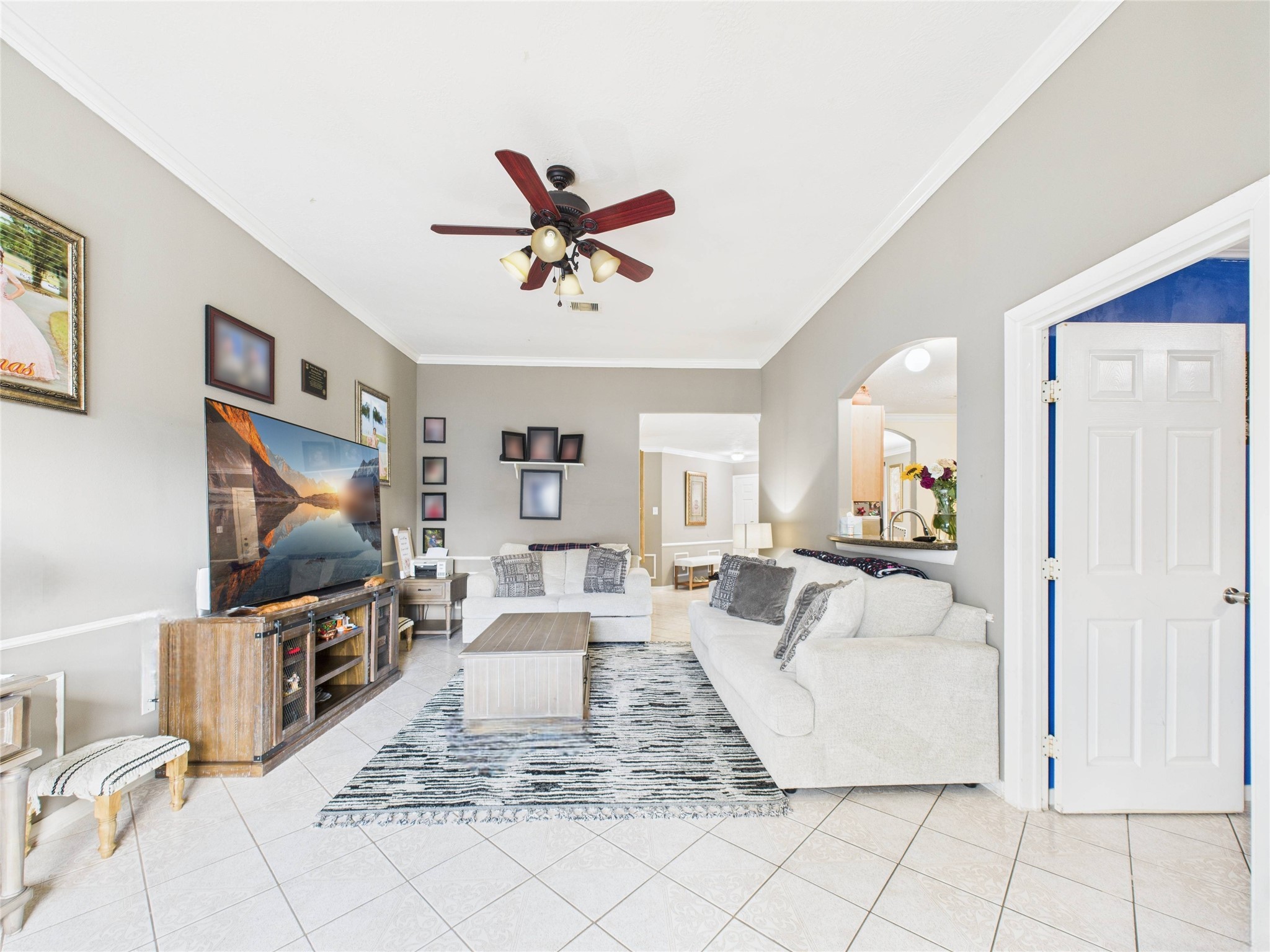 6618 Portlick Drive Katy, TX 77449 - Photo 22 of 40 Spacious living area with vaulted ceiling, crown molding, and large windows bringing in natural light.