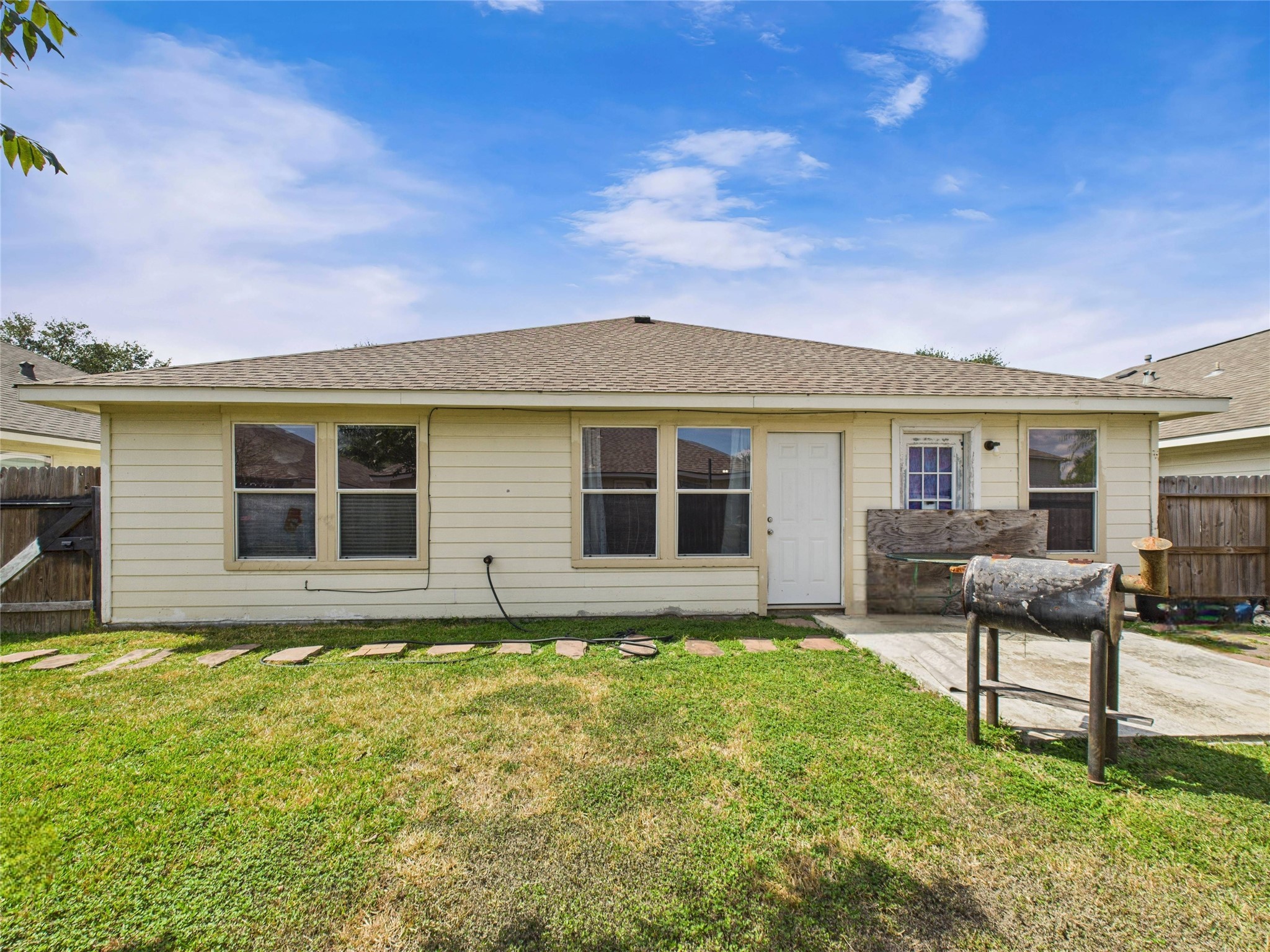 6618 Portlick Drive Katy, TX 77449 - Photo 30 of 40 Fully fenced backyard with patio space, ideal for grilling and outdoor living.