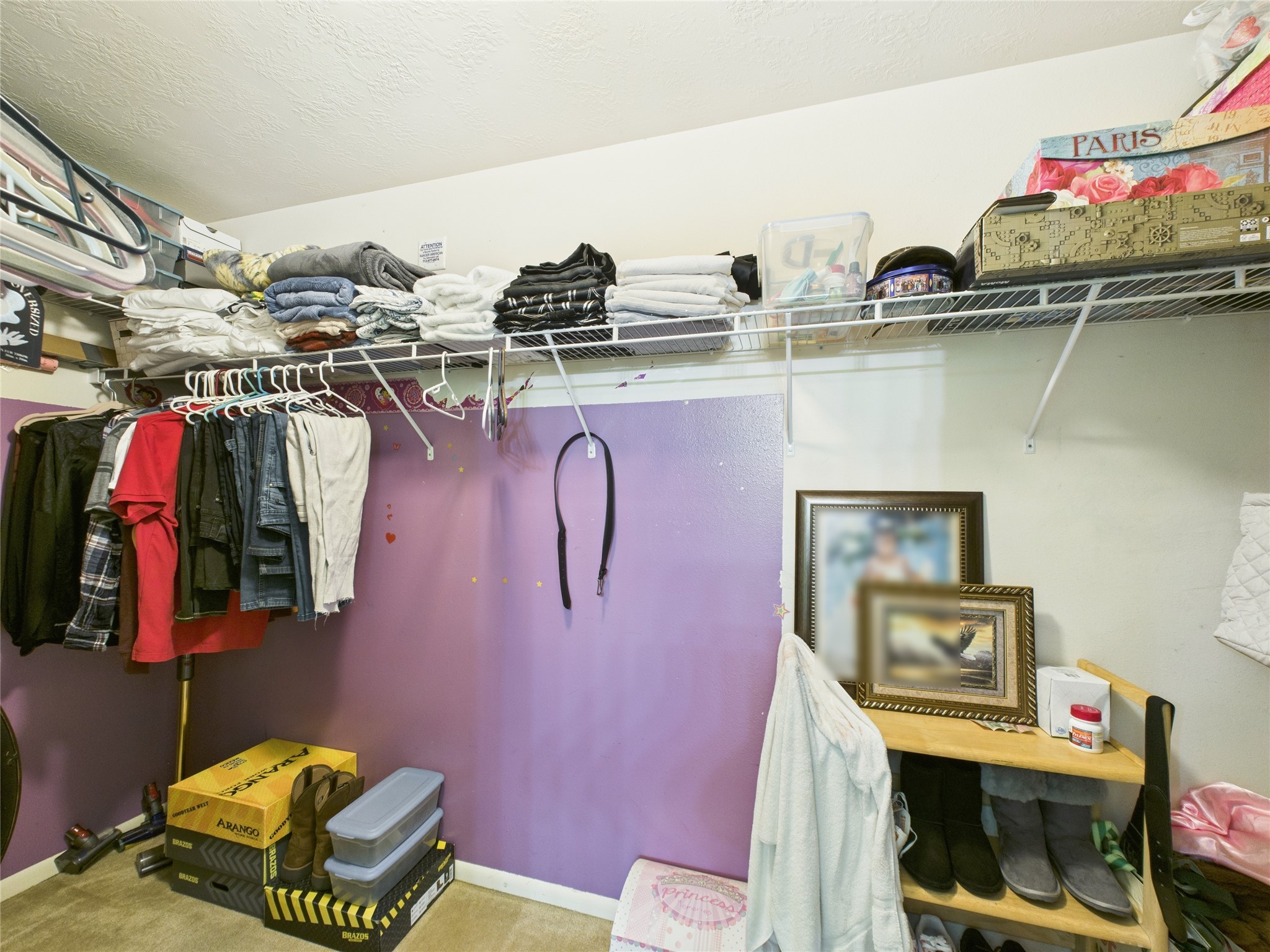 6618 Portlick Drive Katy, TX 77449 - Photo 38 of 40 Walk-in closet with upper shelving and hanging space.