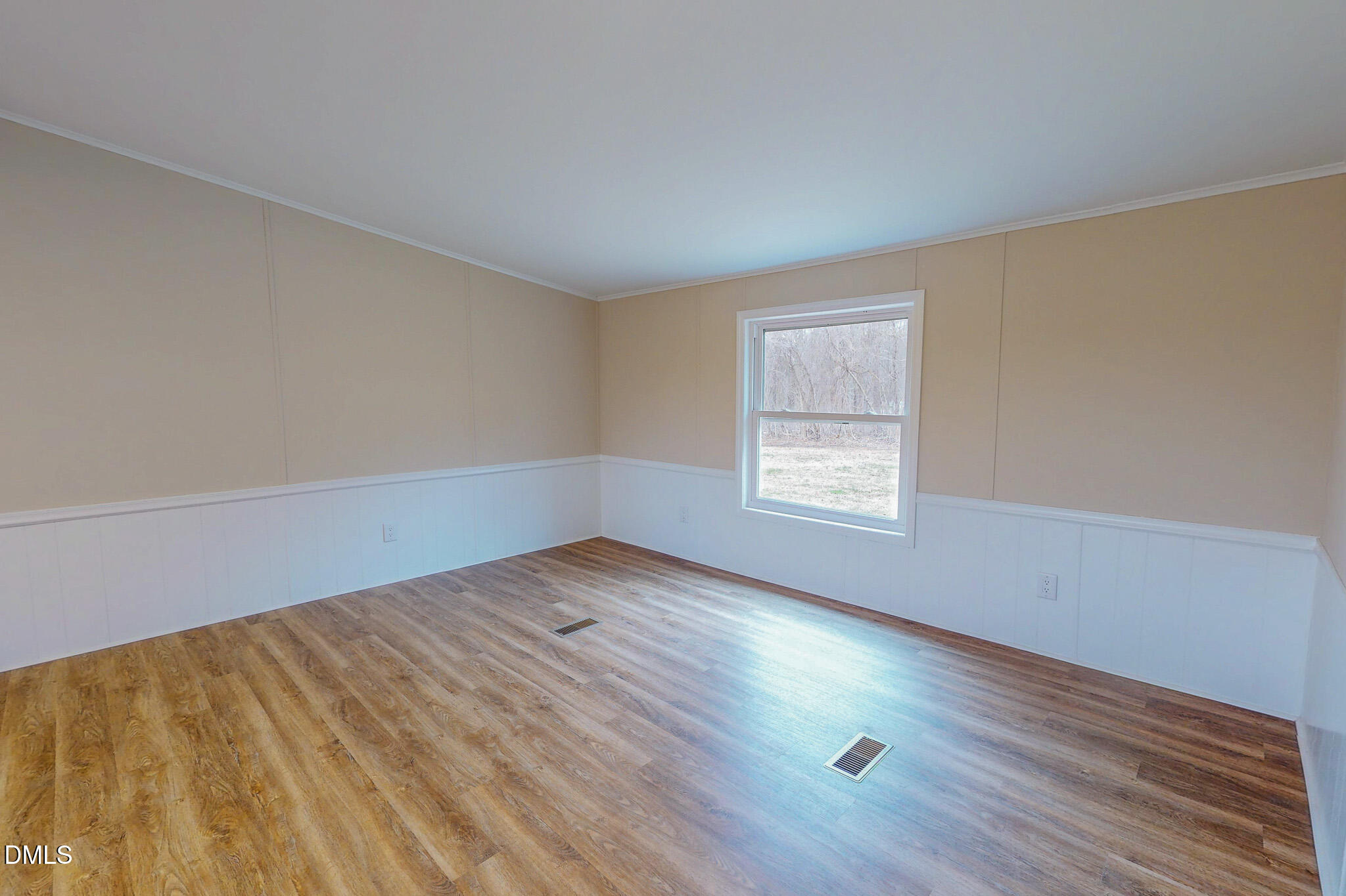 67 Halifax Road Roxboro, NC 27574 - Photo 37 of 48 an empty room with wooden floor and windows
